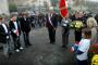 Devant le monument aux morts.